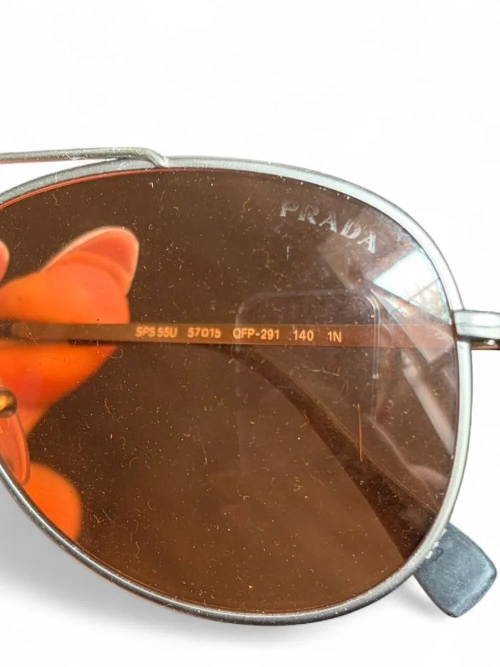 Prada Linea Rossa PS 55US aviator sunglasses, matte silver frame orange lens